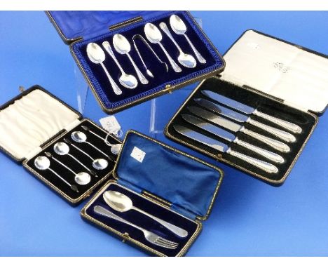 A cased set of six George V silver Teaspoons and Sugar Nips, by James Deakin & Sons, hallmarked Sheffield, 1913, in velvet li