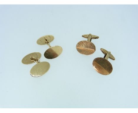 A pair of 9ct yellow gold oval Cufflinks, with chain between, together with another pair of oval cufflinks, the fronts with t