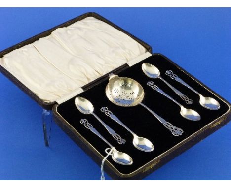 A attractive cased set of six George V silver Teaspoons with Strainer Set, hallmarked Birmingham, 1930, all with pierced Art 