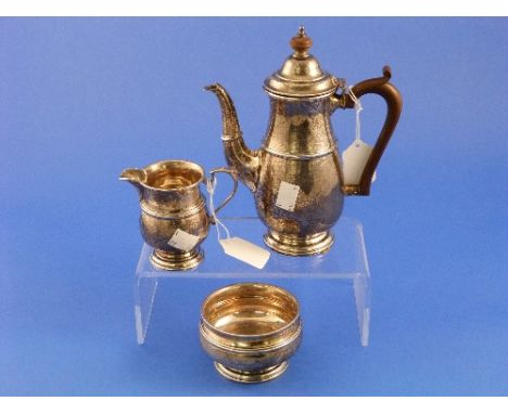 A George V silver three piece 'Bachelor's' Tea Set, by Mappin  & Webb, hallmarked Birmingham, 1922, the teapot of tall balust