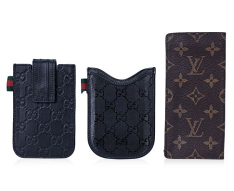 AN ASSORTMENT OF GUCCI AND OTHER DESIGNER LEATHER CASES
Comprising a Guccissima GG leather phone case, strap with button clos