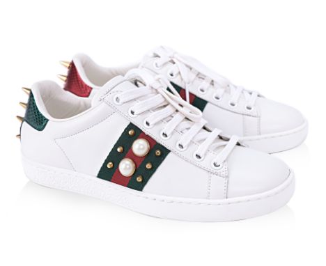 A PAIR OF GUCCI PEARL EMBELLISHED TRAINERS EU 35
White leather faux pearl and stud embellished Ace sneakers, unworn, includes