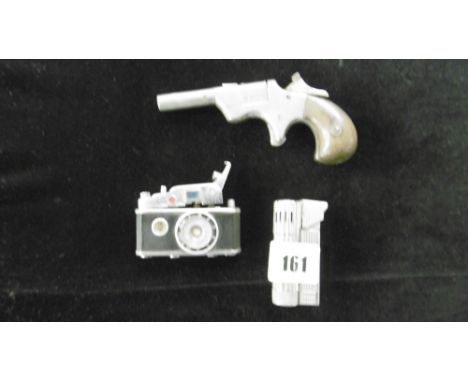 A CAMERA LIGHTER, PISTOL LIGHTER AND ONE OTHER