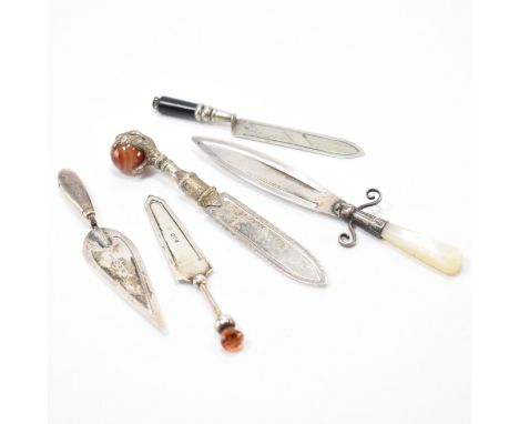 A group of three antique silver trowel bookmarks. The lot to include a trowel bookmark (hallmarked Chester 1887), a silver bo