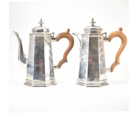 A 1930s Art Deco Carrington &amp; Co silver hallmarked coffee pot and hot water jug. The jugs having reverse tapering bodies 