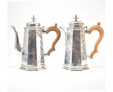 A 1930s Art Deco Carrington &amp; Co silver hallmarked coffee pot and hot water jug. The jugs having reverse tapering bodies 