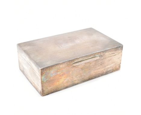 A silver hallmarked cigarette / desk top box. The box having engine turned decoration with an unengraved rectangular panel to