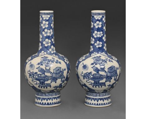 A pair of Chinese blue and white vases, 19th c, painted with auspicious objects reserved on a cracked ice and prunus blossom 