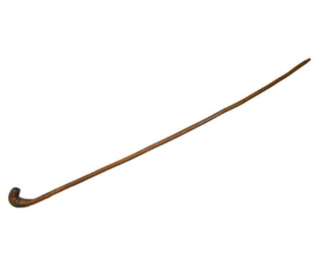 A hollow wood tobacco pipe-cane, probably 19th c, 84cm l  Old knocks and wear, pleasing colour and patina. A curio