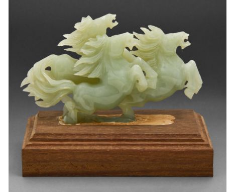 A Chinese jade group of three horses, 20th c, wood base, 19cm h  Undamaged