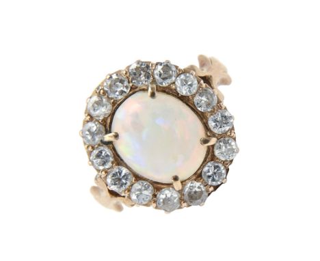 An opal and diamond ring, in gold, head 9 x 11mm, marked 18ct, 4.1g  Opal scratched from wear