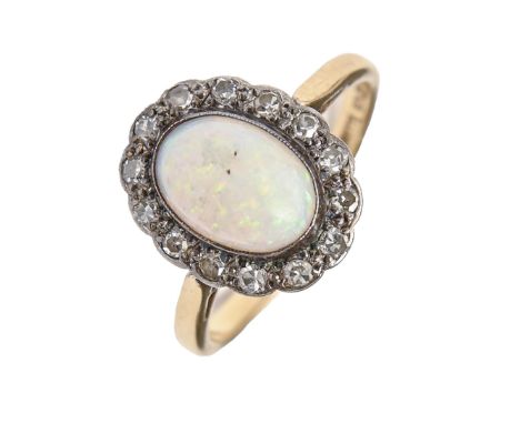 An opal and diamond ring, gold hoop marked 18ct WHITE GOLD, 3.1g, size K  Opal polish dull from scratches and surface chip