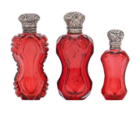 Three similar Victorian silver mounted ruby glass scent bottles, of waisted form, two with stopper, 75-100mm h  One hinge dam