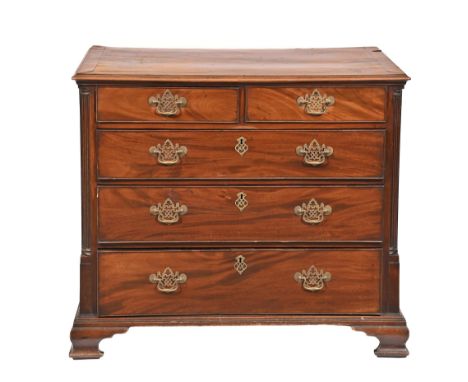 A George III mahogany chest of drawers,&nbsp; of two short and three long drawers flanked by carved pilasters, on bracket fee