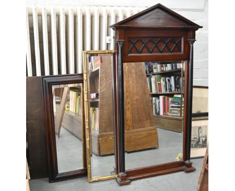A Victorian style mahogany mirror of architectural design, the bevelled plate flanked by a pair of giltmetal mounted ebonised