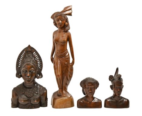 Three South East Asian carved hardwood head sculptures and a statuette of a semi-naked woman, Bali, 20th c, statuette 64cm h 