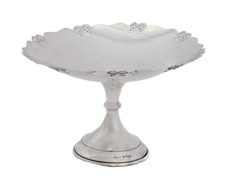 A George V silver cake stand, with ribbon bow border, 19.5cm diam, by Britton, Gould &amp; Co, Birmingham 1932, 7ozs 11dwts  