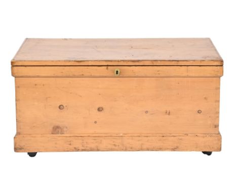 A Victorian waxed pine trunk, with iron handles, on later castors, 54cm h; 107 x 53cm  Scuffs, scratches and marks consistent