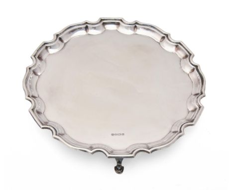 An Elizabeth II silver salver, on three hoof feet, 25.5cm diam, by Francis Howard Ltd, Sheffield 1987, cased, 16ozs 10dwts  L