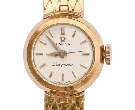 An Omega 18ct gold lady's wristwatch, Ladymatic, 18mm diam, on 18ct gold bracelet with plain deployant buckle, Birmingham 195