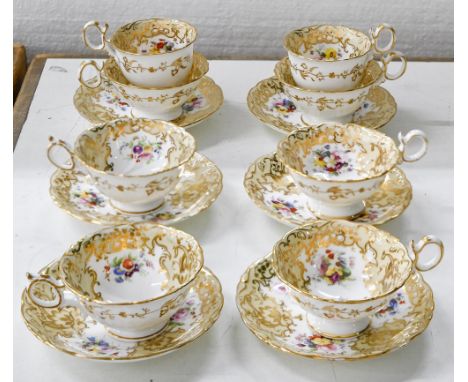 A set of four Coalport teacups and saucers and two trios, c1840, of Adelaide shape, painted with floral sprays in buff and gi