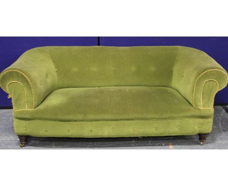 Victorian mahogany, buttonback Chesterfield style sofa, raised on turned supports, upholstered in green. 