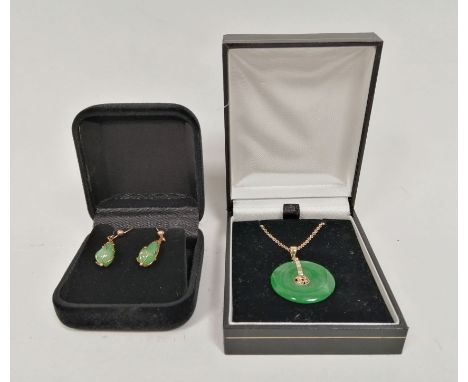 Jade disc pendant with gold mounts and necklet and a pair of drop earrings, similar.  Condition report:It appears to be natur