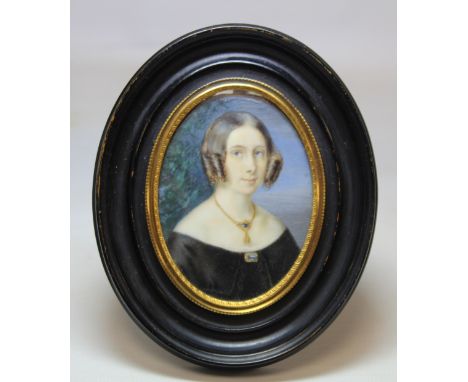 19th century miniature portrait of a lady, watercolour on ivory, 7.5cm x 5.5cm (oval) in oval ebonised frame with gilt metal 