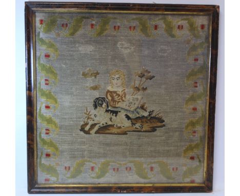 Victorian tapestry panel depicting a small boy with a spaniel surrounded by stylised foliate border, worked in polychrome, wo