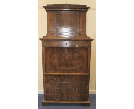 19th century Beidermeier secretaire abbatant, the upper section with architectural pediment over panel door cupboard, the fal