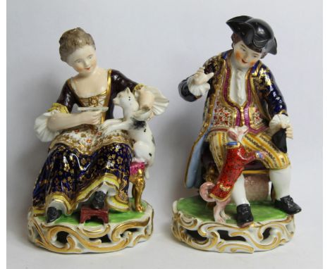 Pair of early 19th century Derby porcelain figures, no. 362, the boy playing with a dog dressed in a red spotted jacket, his 