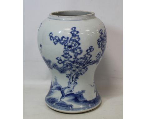 Antique Chinese blue and white porcelain vase of waisted baluster form with continuous landscape of pine trees, bamboo and pr