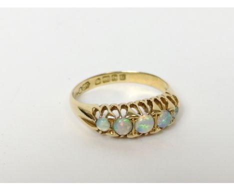 Five stone opal ring in 18ct gold, 1919. Size 'O'. 