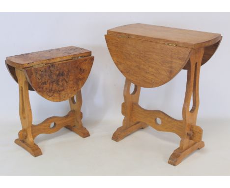 Two miniature drop flap occasional tables, one of burr oak, the other plain oak, each with oval swivel tops, pierced supports