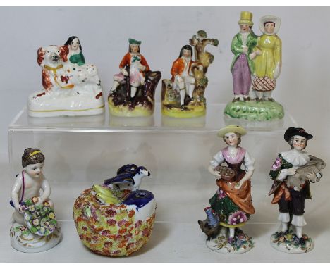 19th century Staffordshire porcelain inkwell or pen holder, 7cm diam.; two miniature pen holders surmounted by a huntsman and