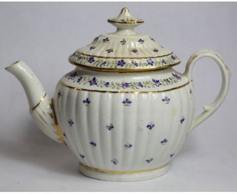 Late 18th century Chamberlain's Worcester teapot of new fluted oval form, decorated with blue floral sprigs and gilt, pattern