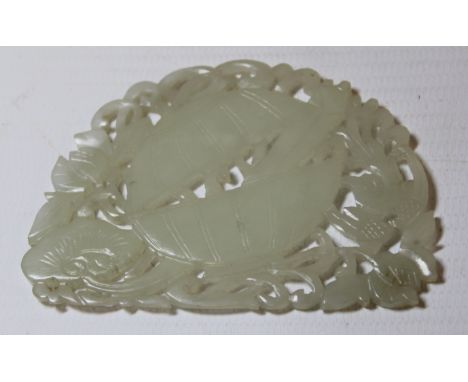 Chinese pierced and carved jade plaque decorated with a lidded vessel containing precious things surrounded by phoenix, flowe