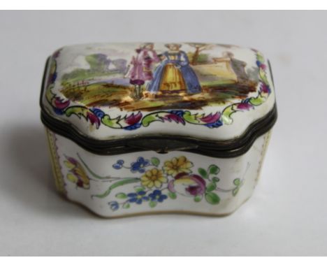 Antique French faience trinket box of rectangular form with serpentine front, the hinged cover with metal mounts and panel de