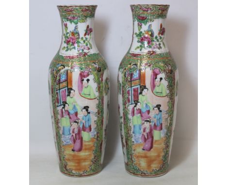 Pair of late 19th/early 20th century Chinese famille rose vases of slender reeded baluster form with alternating panels of fi
