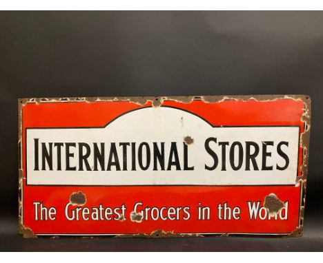 An International Stores grocers enamel sign, circa 1930s, 30 1/4 x 15".