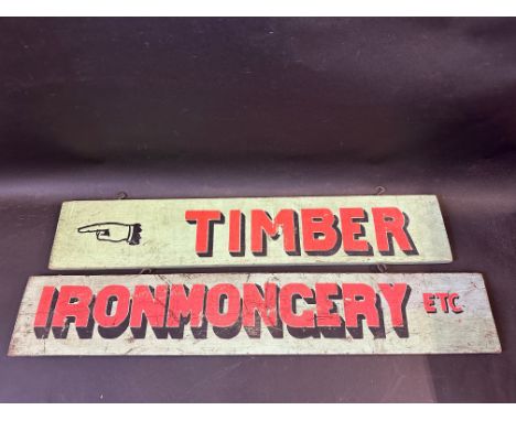 Two double sided painted wooden shop information signs, Ironmongery, Electrical, Timber and Tools, the larger 35 x 6".