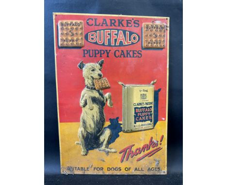 A truly fantastic pictorial embossed tin sign by F. Francis &amp; Sons, Deptford advertising Clarke's Buffalo Puppy Cakes, 12