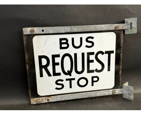 A Bus Request Stop double sided enamel sign within mounting brackets, 14 1/2 x 11 1/2". 