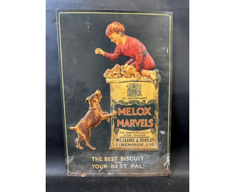 A superb pictorial tin sign advertising Melox Marvels, embossed with boy sat upon a bag of dog biscuits teasing a dog below, 