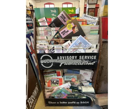 A BOCM branded leaflet rack with assorted contents and promotional material relating to products sold by Moore &amp; Sons, Fr