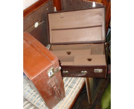 Vintage leather cases, one with fitted interior
