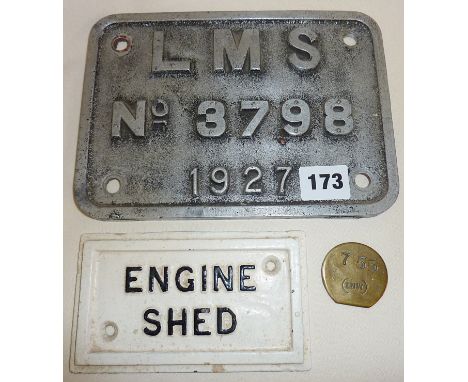 LMS 1927 aluminium wagon plate, cast iron Engine Shed plate, and an LNW (London North Western Railway) brass token