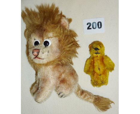 Vintage Schuco Piccolo mini teddy bear, and a vintage lion toy with swivel head