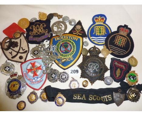 Assorted vintage police cap badges etc., inc. Metropolitan, military bullion badges, buttons, first aid medals, etc.
