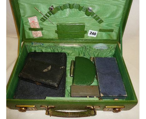 Vintage green case containing sewing and manicure sets, thimbles, needle cases, etc.